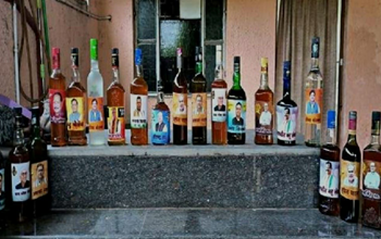 photo of chhattisgarh minister in liquor bottle